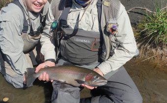 A tough fighting 6 pound rainbow trout from this morning's fishing on the Tongariro, caught by your humble author and netted by our guide Rob Vaz. My boys James and Jack (shown here) also caught and released two trout each. What a team!
